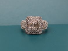 Gemporia - An 18ct gold diamond cluster ring,