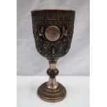 A white metal chalice from Thailand, decorated with figures, leaves and flowers engraved "Bangkok U.