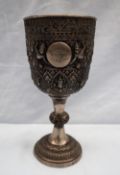 A white metal chalice from Thailand, decorated with figures, leaves and flowers engraved "Bangkok U.