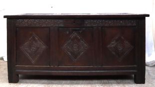 An 18th century oak coffer,