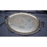 An Edwardian silver twin handled tray, of oval form, with a shell and gadrooned border, Sheffield,