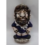 A John Hughes pottery Grogg of a Scottish player with no 6 to the reverse,