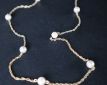A 9ct gold pearl necklace, mounted with seven pearls on a rope twist chain, 58.