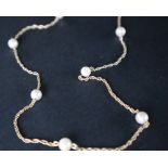 A 9ct gold pearl necklace, mounted with seven pearls on a rope twist chain, 58.