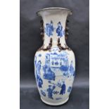 A Chinese blue and white baluster vase decorated with applied dragons,