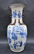 A Chinese blue and white baluster vase decorated with applied dragons,