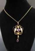 An Edwardian 9ct gold amethyst and seed pearl pendant of heart shape, on a 9ct gold chain,