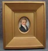 19th century British School Head and shoulders portrait of a gentleman in a black frock coat