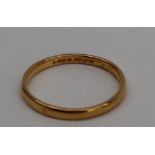 A 22ct gold wedding band, size Q, approximately 2.
