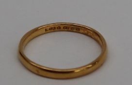 A 22ct gold wedding band, size Q, approximately 2.