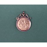 A George V gold half sovereign dated 1913 in a 9ct gold pendant mount, approximately 5.