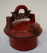 A Chinese rice bucket, of oval form, the arched handle carved and pierced,