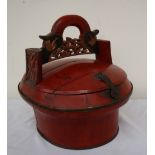 A Chinese rice bucket, of oval form, the arched handle carved and pierced,