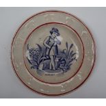 A 19th century child's plate, with a leaf moulded border,