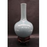 A 19th century Chinese blue Celadon bottle vase, decorated with scrolling leaves,