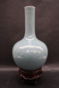 A 19th century Chinese blue Celadon bottle vase, decorated with scrolling leaves,