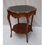 A French Kingwood, parquetry and ormolu mounted centre table with a shaped leather inset top,