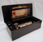 A 19th century Swiss musical box, in a simulated rosewood box, playing ten airs,