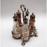 A George V silver married cruet, with five bottles, various dates,