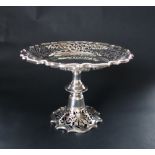 An Edward VII silver pedestal comport, with a shaped circular top with a pierced rim,