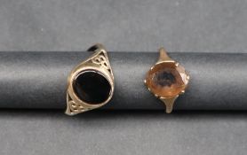 A 9ct gold signet ring, with an onyx panel to pierced shoulders,