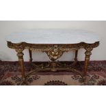 A French carved giltwood and gesso centre table with a shaped white marble top,