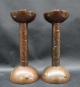 A pair of Newlyn copper candlesticks, with a flared top,