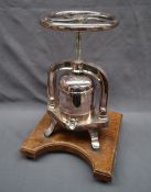 A Birmingham Silver Plate Ltd electroplated duck press, with a five spoked turning wheel,