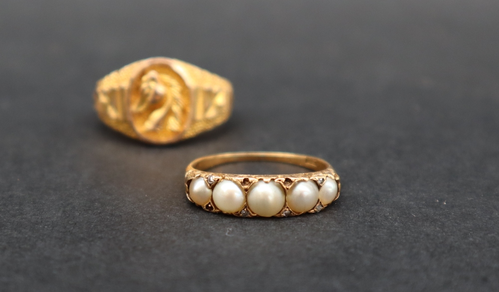 An 18ct gold ring set with five graduated half pearls, size P 1/2, approximately 3.