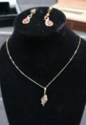 A 9ct gold ruby set pendant, together with similar earrings, A Dunhill roller ball pen, faux pearls,