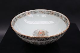 A Chinese porcelain bowl, painted with fans, basket etc, 17.