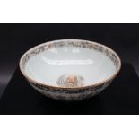 A Chinese porcelain bowl, painted with fans, basket etc, 17.