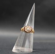 An 18ct yellow gold diamond cluster ring, set with round old cut diamonds, size M,