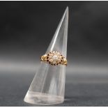 An 18ct yellow gold diamond cluster ring, set with round old cut diamonds, size M,