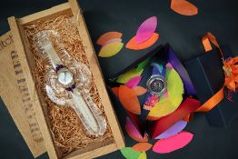 A Swatch Chandelier wristwatch, with original glass stand, wooden box and shavings,