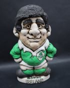 A John Hughes pottery Grogg of a Rugby player in Irish kit with no 9 to the reverse,