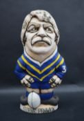 A John Hughes pottery Grogg of Steve Fenwick in Cardiff City Blue Dragons kit with no 3 to the