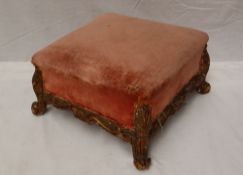 A French giltwood and gesso foot stool of square form, carved with leaves on scrolling feet,