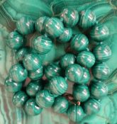 A string of spherical Malacite beads, approximately 110 grams,