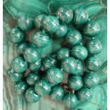 A string of spherical Malacite beads, approximately 110 grams,