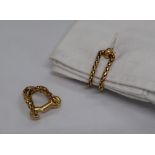 A pair of Boucheron yellow metal cufflinks of woven chain form and hook shaped fastenings,