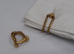 A pair of Boucheron yellow metal cufflinks of woven chain form and hook shaped fastenings,