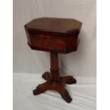 A William IV rosewood teapoy, the octagonal hinged moulded top enclosing two lidded tea caddies,