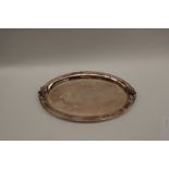 A modern silver dish of oval form with grape and leaf applied decoration, London, 1999,