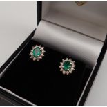 A pair of emerald and diamond earrings,