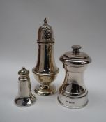 An Elizabeth II silver sugar caster, with a pointed finial, pierced domed cover,