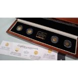 A 2009 Year of Gold commemorative crown set, including a Charles Darwin 1/25th of an ounce .