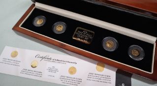 A 2009 Year of Gold commemorative crown set, including a Charles Darwin 1/25th of an ounce .