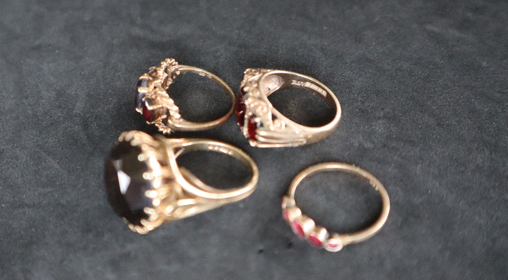 A 9ct gold ring set with three oval faceted garnets, - Image 3 of 3