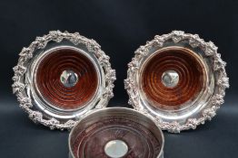 A pair of modern silver bottle coasters with a grape and leaf border, Birmingham, 2000,